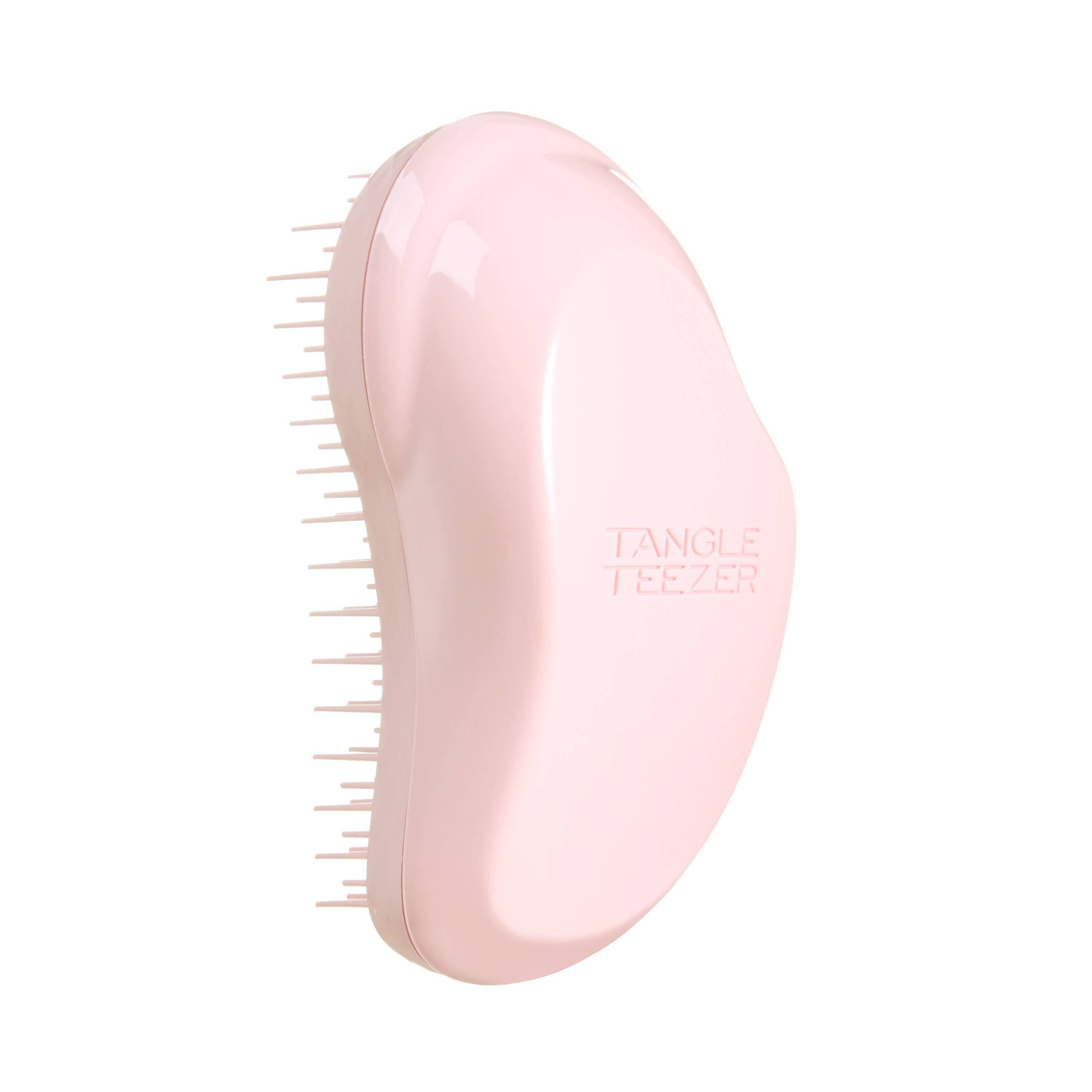 Tangle Teezer Original Mini Millennial Pink hairbrush with ergonomic design and two-tiered teeth technology for effortless detangling. Compact and ideal for kids or travel.
