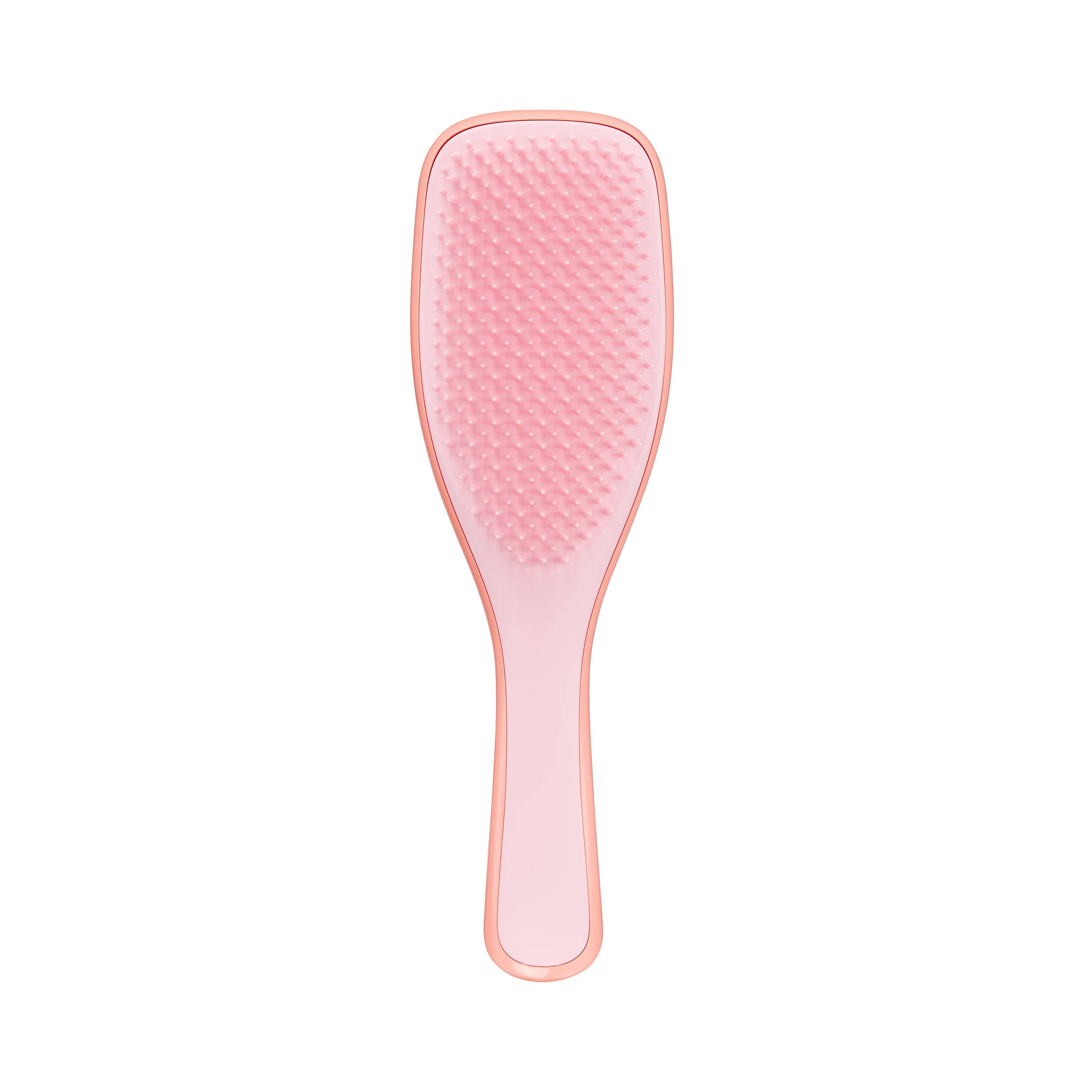 Tangle Teezer The Ultimate Detangler Naturally Curly in orange-pink, designed for wet detangling of curly and coily hair. Features long, strong two-tiered teeth for gentle, breakage-free styling.