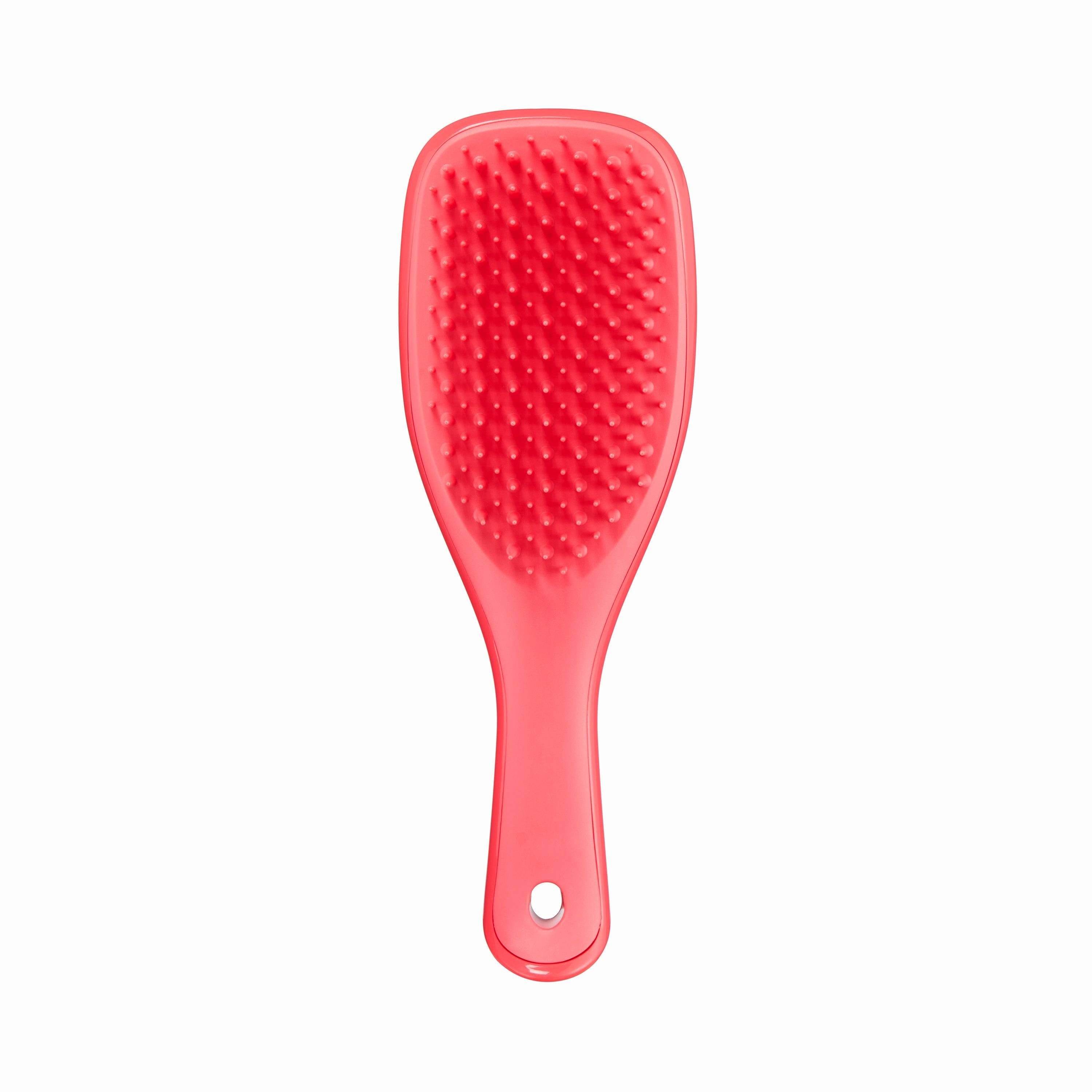 Tangle Teezer Mini Ultimate Detangler Pink Punch, a compact hairbrush with two-tiered teeth technology for gentle detangling of wet or dry hair. Ideal for all hair types and travel-friendly.