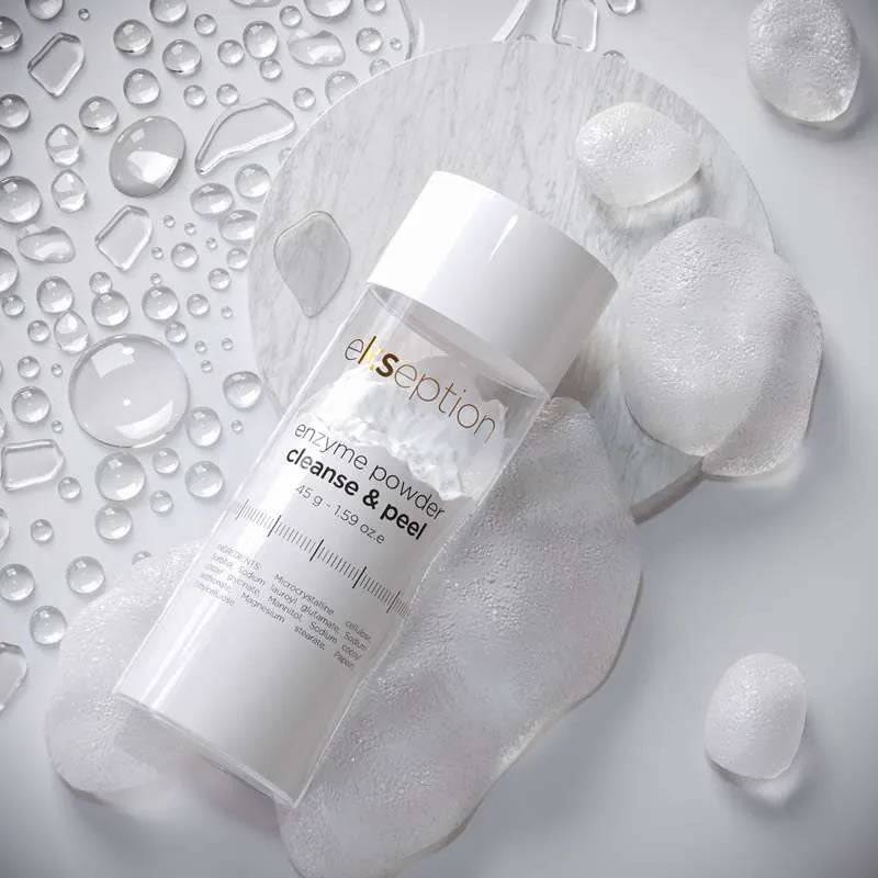 Ekseption Enzyme Powder Cleanse & Peel 45g placed on a wet surface with foam and water droplets. Deeply purifies and brightens all skin types.