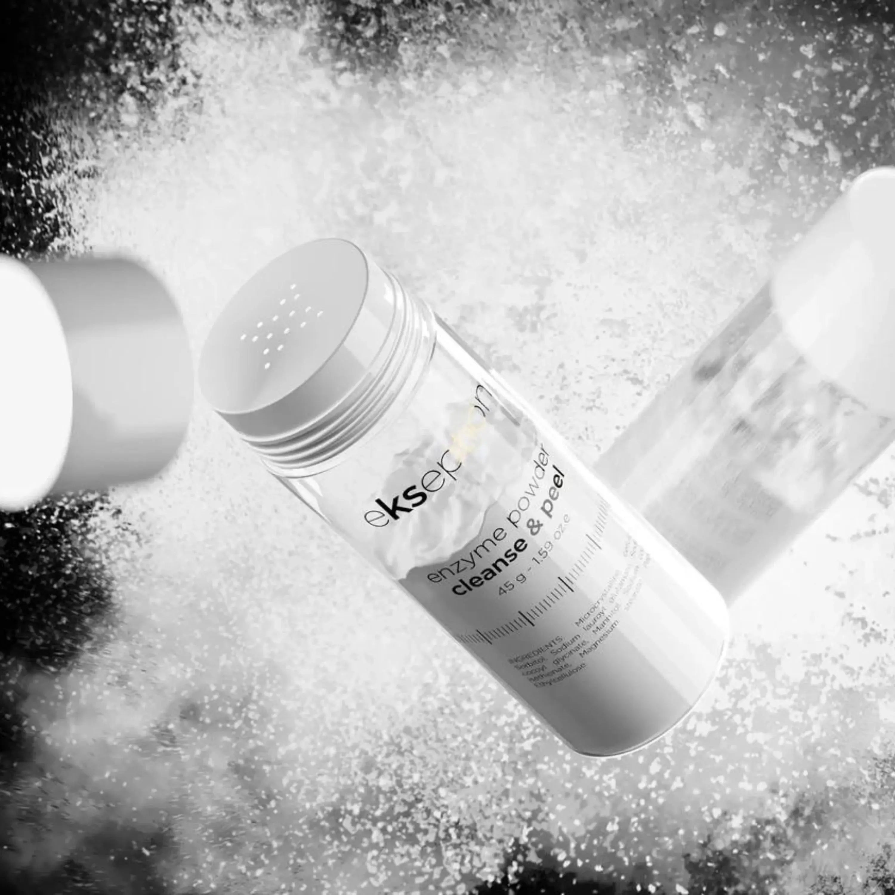 Ekseption Enzyme Powder Cleanse & Peel 45g in motion with powder dispersion. A powerful yet gentle enzyme exfoliator for a radiant complexion.
