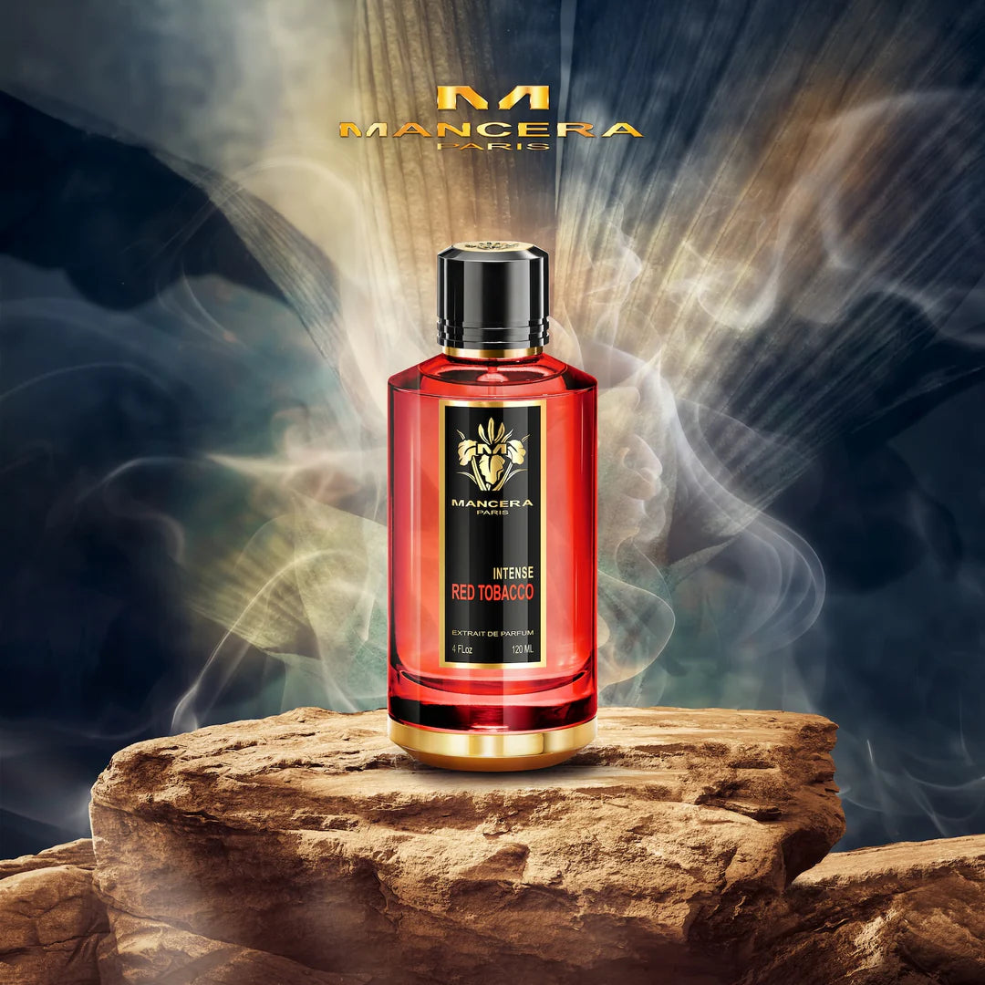 Mancera Red Tobacco Perfume bottle on rocky surface with dramatic lighting, representing its intense woody and oriental fragrance.