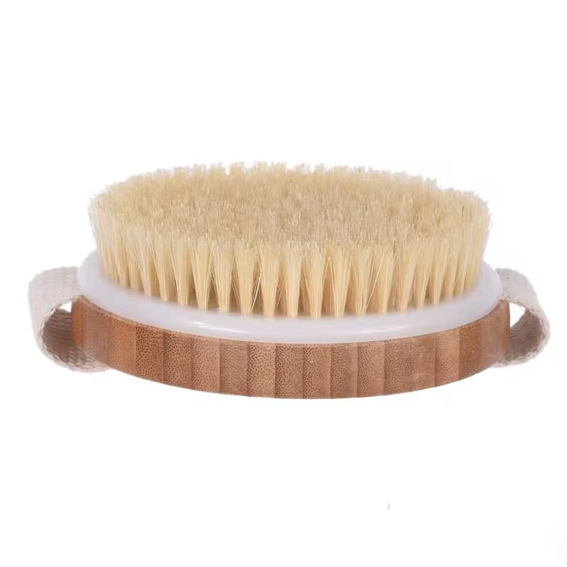 Side view of Mermaid Dry Brush featuring firm natural bristles and a wooden handle with strap, perfect for dry brushing and cellulite reduction.