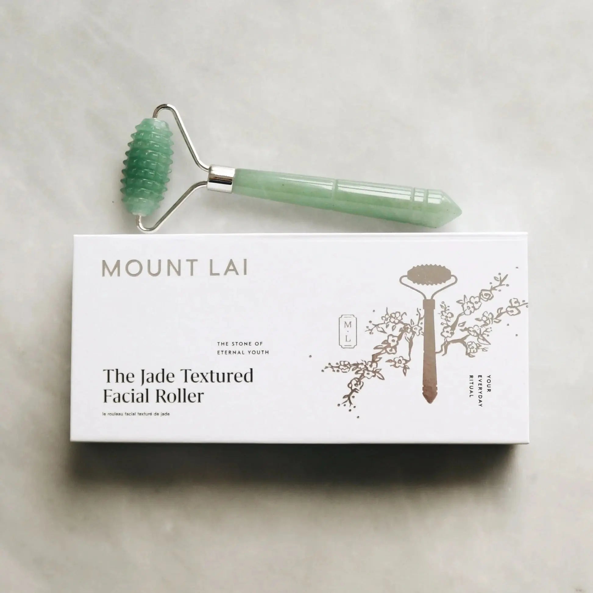 Mount Lai The Jade Massage Textured Facial Roller displayed on its elegant packaging, highlighting its luxurious jade construction and skincare benefits.