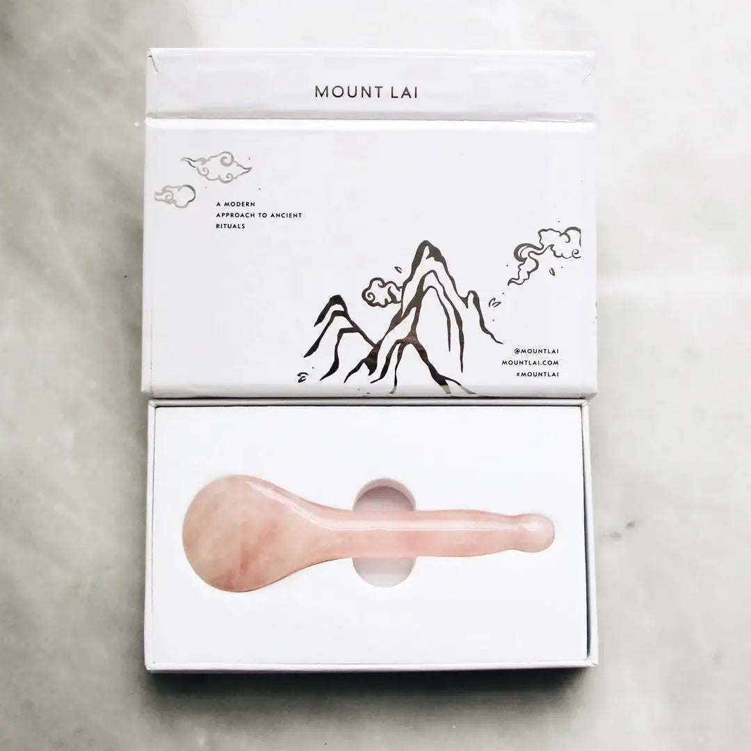 Mount Lai The Rose Quartz Acupressure Gua Sha Spoon in elegant packaging, featuring a minimalist design with a mountain illustration, perfect for skincare and relaxation.