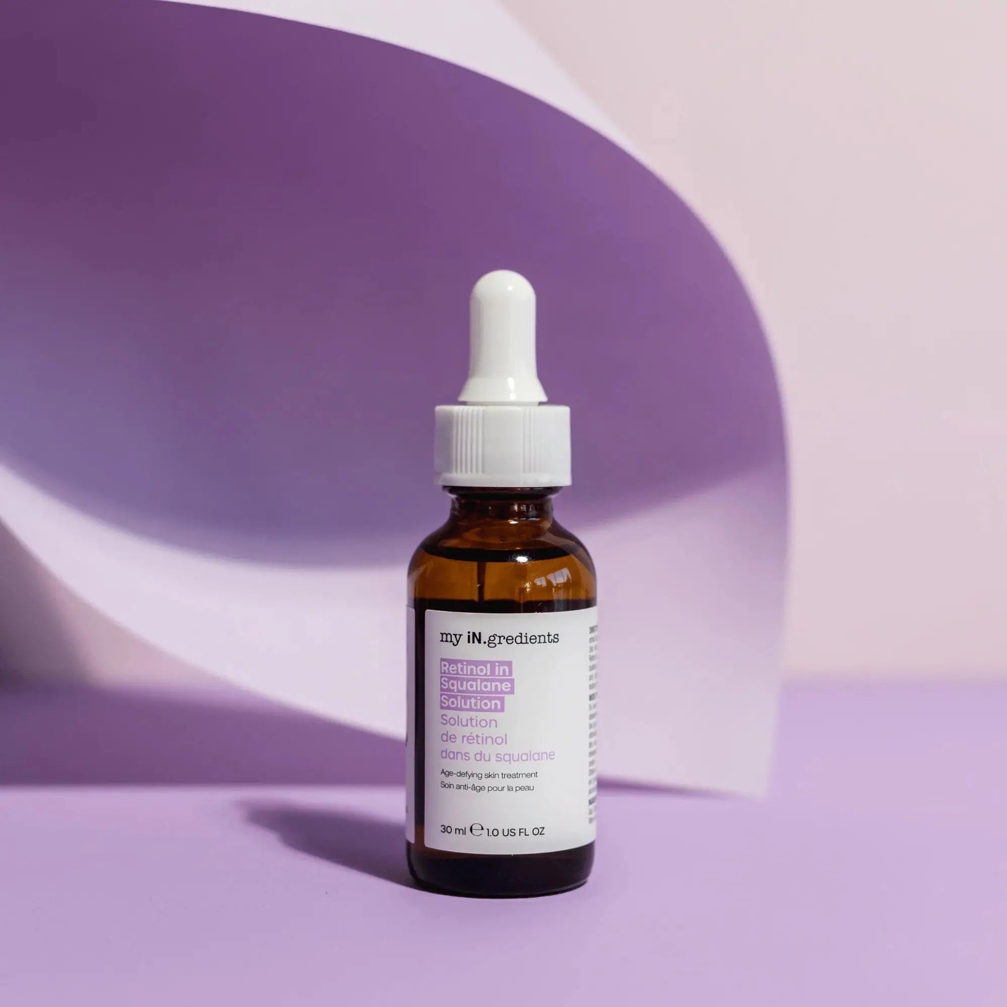 My iN.gredients Retinol in Squalane Solution 30ml bottle displayed against a soft purple background, ideal for anti-aging skincare.