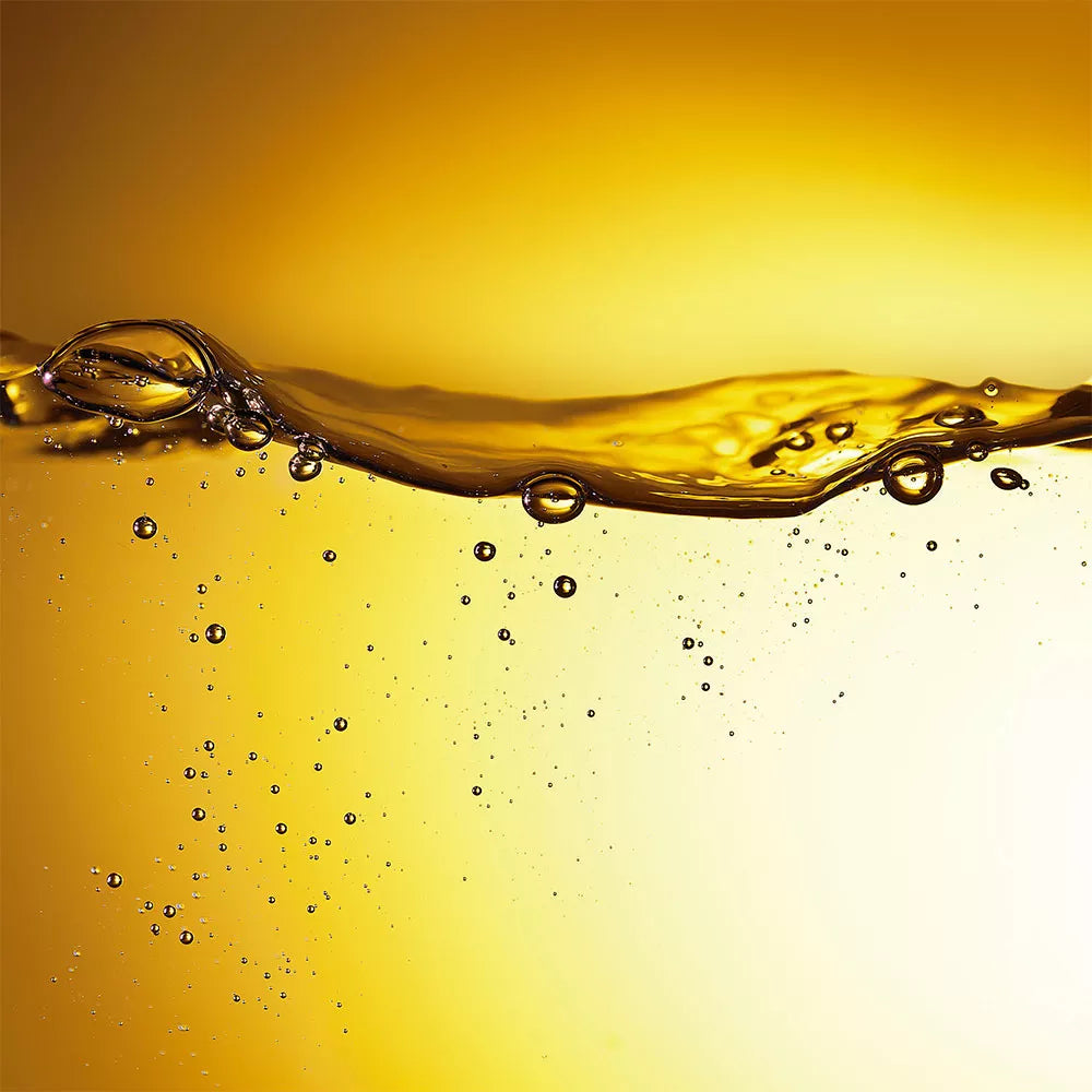 Golden liquid wave with bubbles