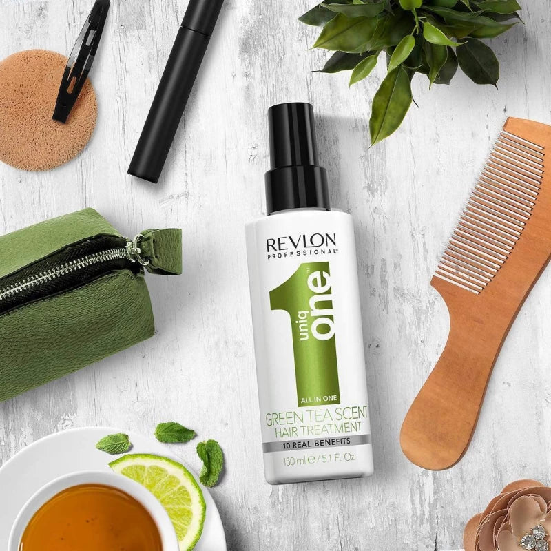 Revlon Uniq One Green Tea Leave-in Treatment on wooden table