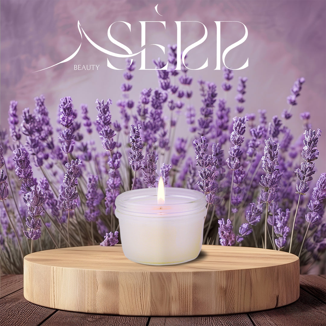 SerrBeauty Organic Lavender & Patchouli Beeswax Scented Candle burning on a wooden platform, set against a scenic lavender field backdrop.