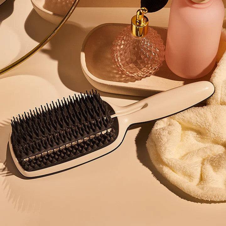 Tangle Teezer Blow Styling Full Paddle Brush in Blue-Cream, designed for smooth, frizz-free blow-drying. Features unique fixed-base teeth for faster drying.