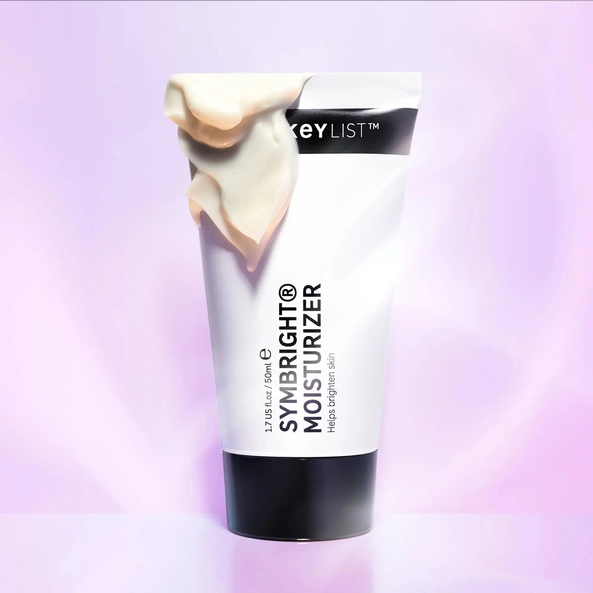 The Inkey List Symbright Moisturizer 50 ml with a creamy texture draped over the tube. A hydrating formula that enhances skin radiance and smoothness.