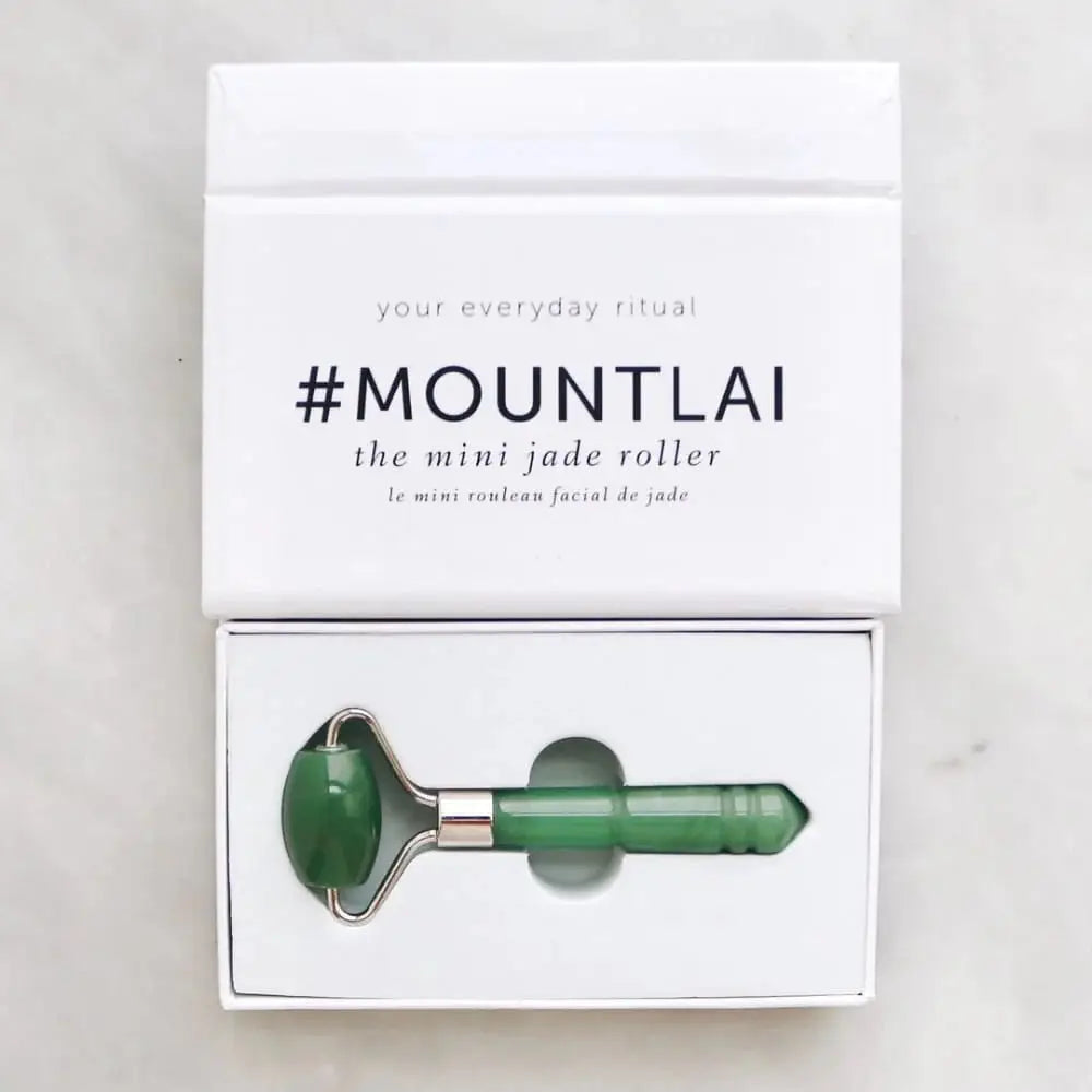 Mount Lai The De-Puffing Mini Jade Roller in its elegant white packaging, highlighting its compact design for targeted facial massage and skincare benefits.
