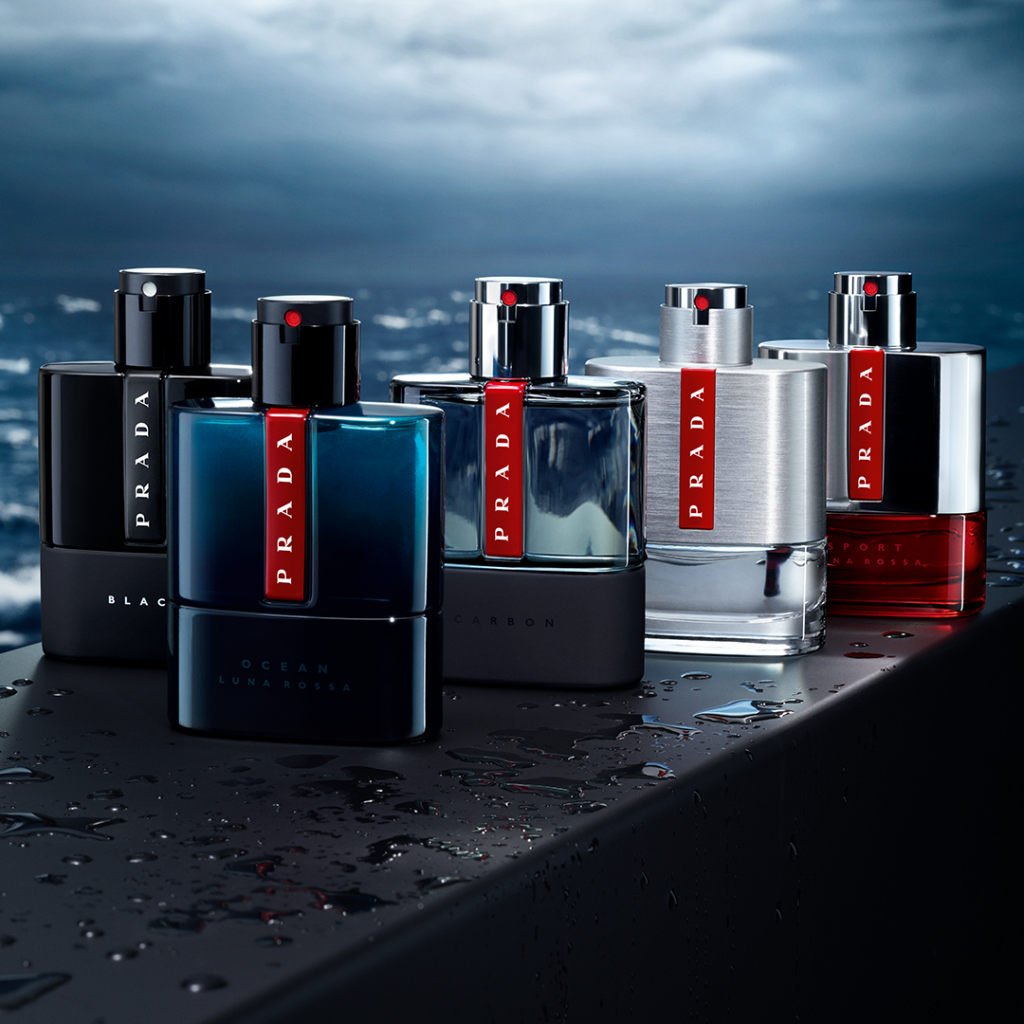 Luxurious Prada colognes displayed against a sleek ocean backdrop.
