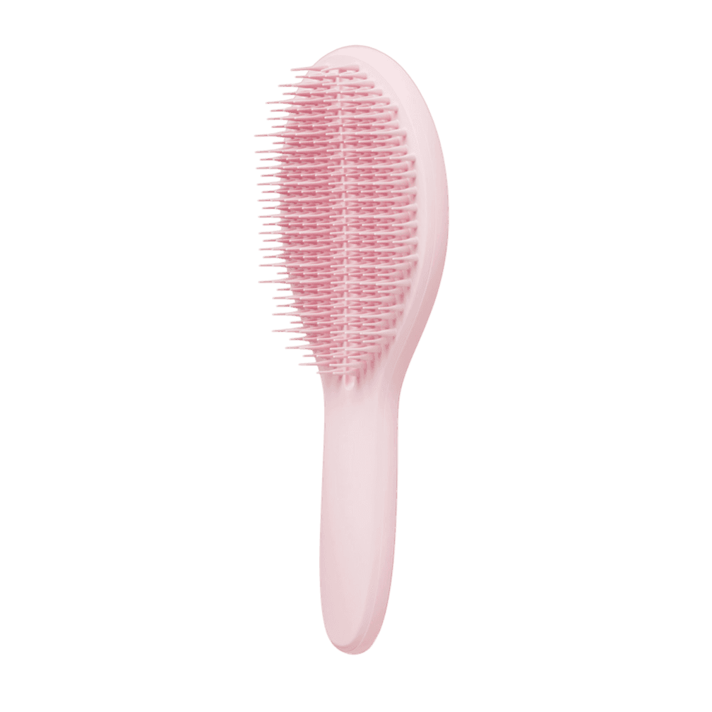 Tangle Teezer The Ultimate Styler Millennial Pink Hair Brush with ergonomic handle and two-tiered teeth technology for smooth styling and detangling.