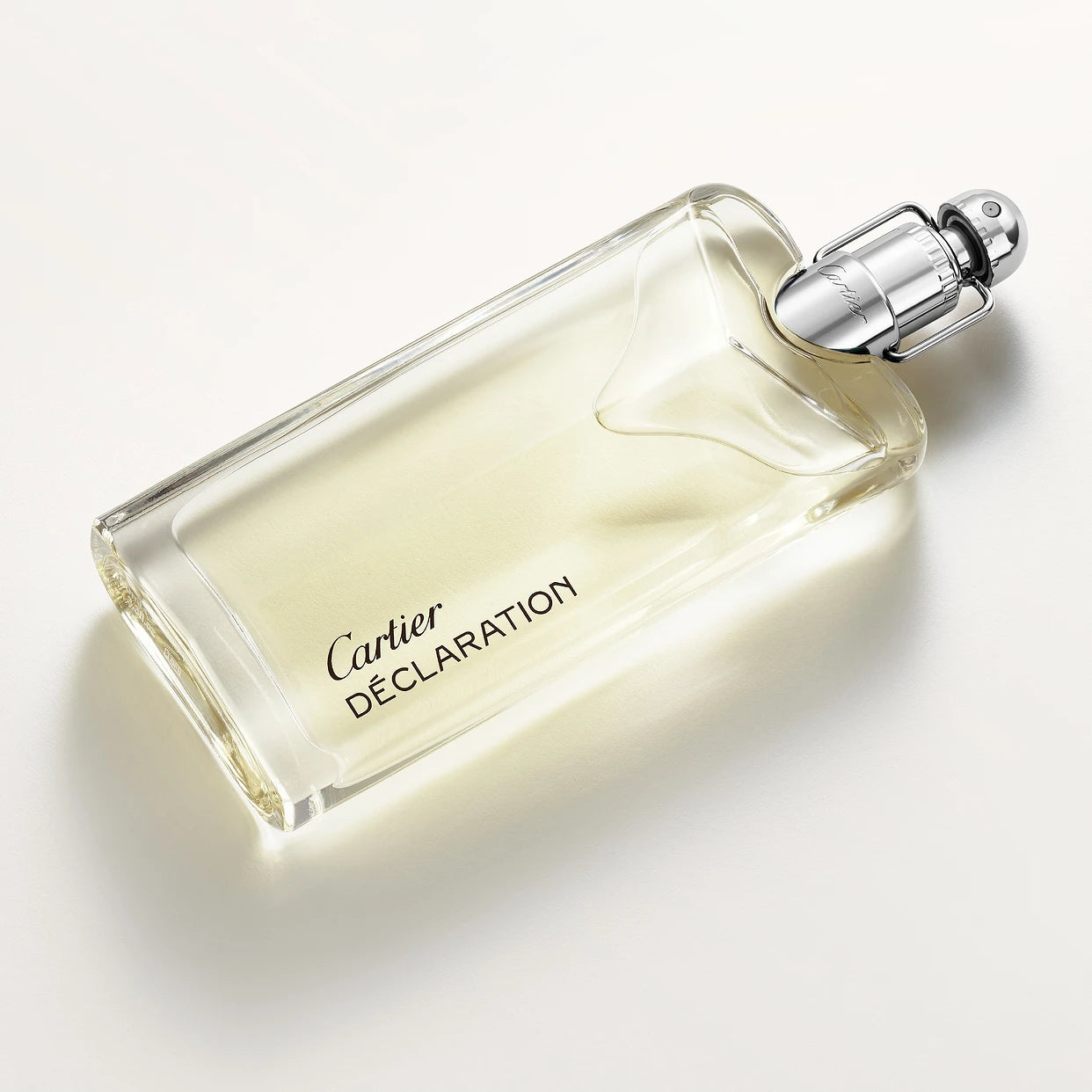 Cartier Declaration Eau De Toilette 100 ml bottle lying flat, highlighting its sleek design and refined men's fragrance appeal.