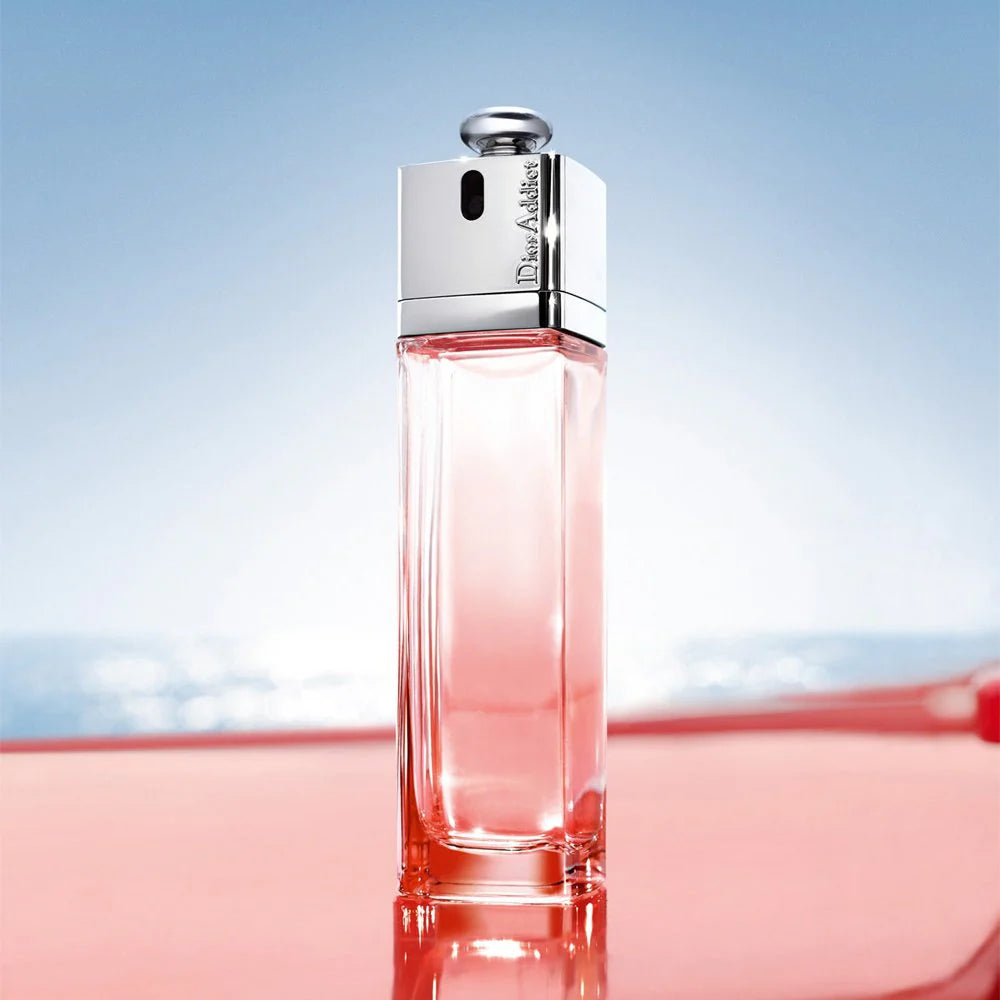 Dior Addict Eau Delice 100ml Perfume bottle displayed against a serene ocean backdrop, highlighting its elegant floral fruity fragrance.
