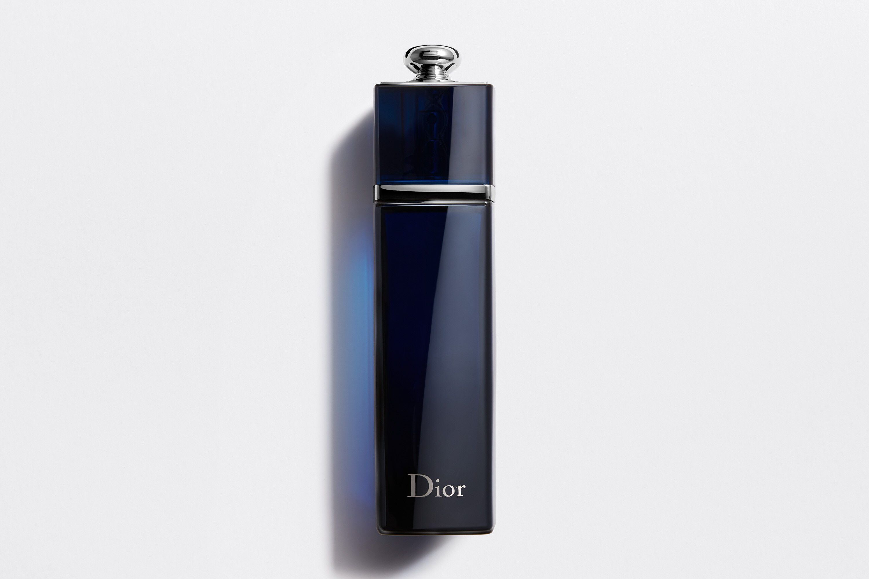 Dior Addict Eau De Parfum 50ml bottle in deep blue with silver cap, showcasing elegant design for a fresh jasmine and vanilla fragrance.