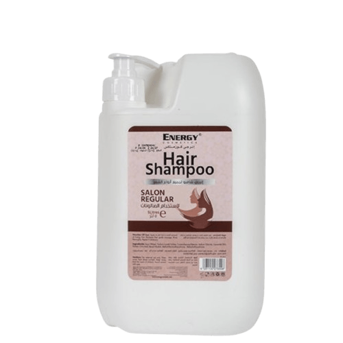 White plastic bottle of ENERGY Hair Shampoo with pump dispenser, label indicates natural shampoo for all hair types, salon regular size