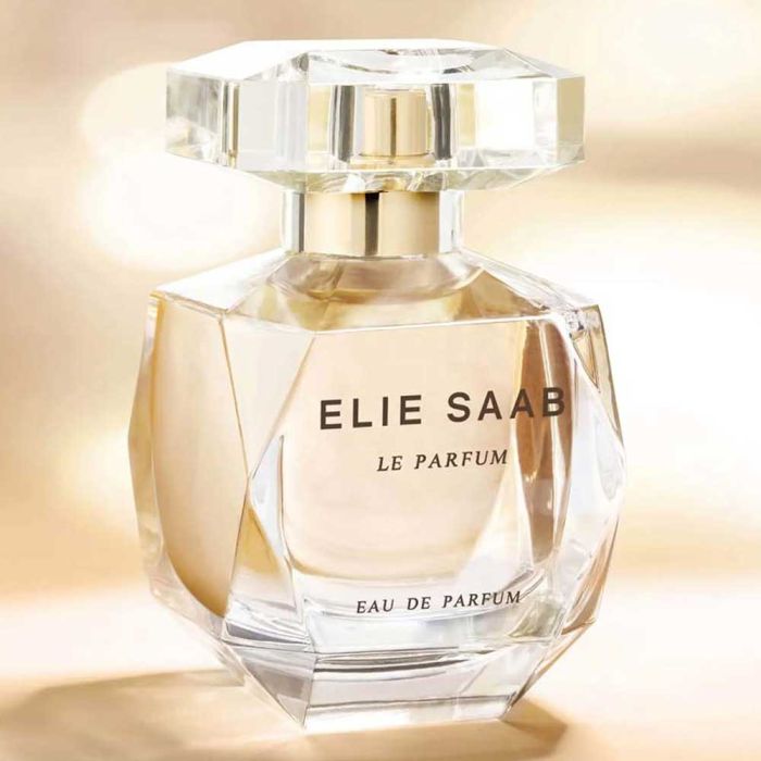 Elie Saab Le Parfum EDP 90ml displayed in warm lighting, highlighting its luxurious crystal-cut bottle and golden scent tones.