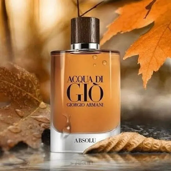 Giorgio Armani Acqua Di Gio Absolu EDP 100 ml set in an autumnal scene with leaves, reflecting its warm, woody, and aquatic fragrance notes.
