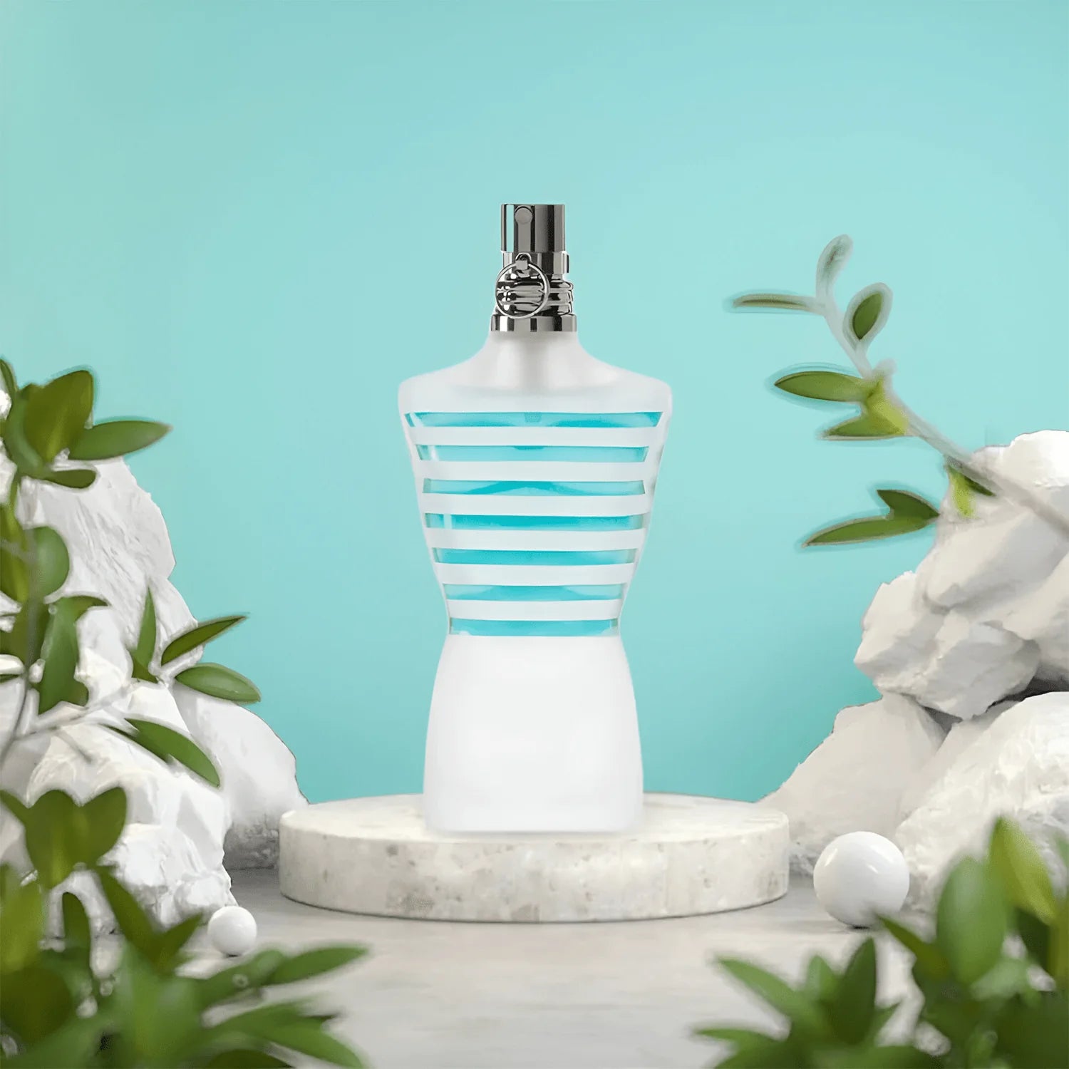 Jean Paul Gaultier Le Beau Male 125ml EDT displayed on marble pedestal with green foliage, highlighting its fresh Aromatic Fougere scent for men.