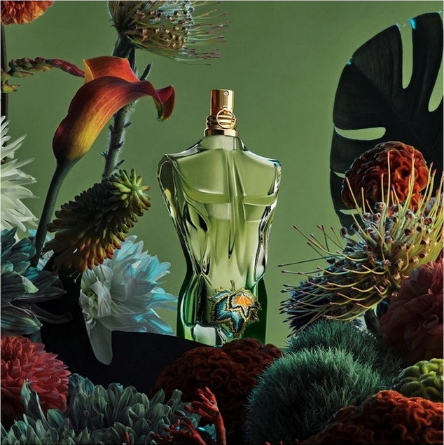 Le Beau Paradise Garden by Jean Paul Gaultier showcased in a botanical setting, emphasizing its tropical and woody masculine scent.