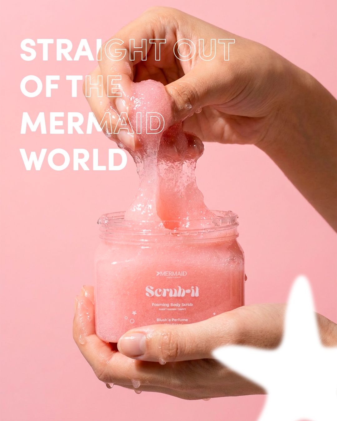 Mermaid Foaming Body Scrub being stretched from jar, highlighting its jelly texture for exfoliation and radiant skin benefits.