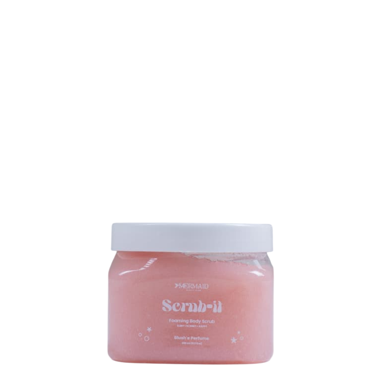 Mermaid Foaming Body Scrub in a clear jar with white lid, ideal for exfoliation and smooth radiant skin care routine.