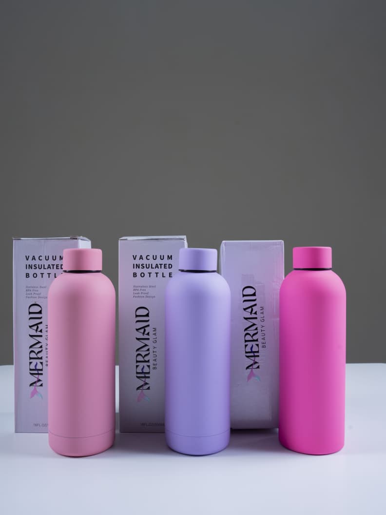 500ml Mermaid water bottles in vibrant colors with boxes, lightweight and reusable, perfect for kitchen or gym use.