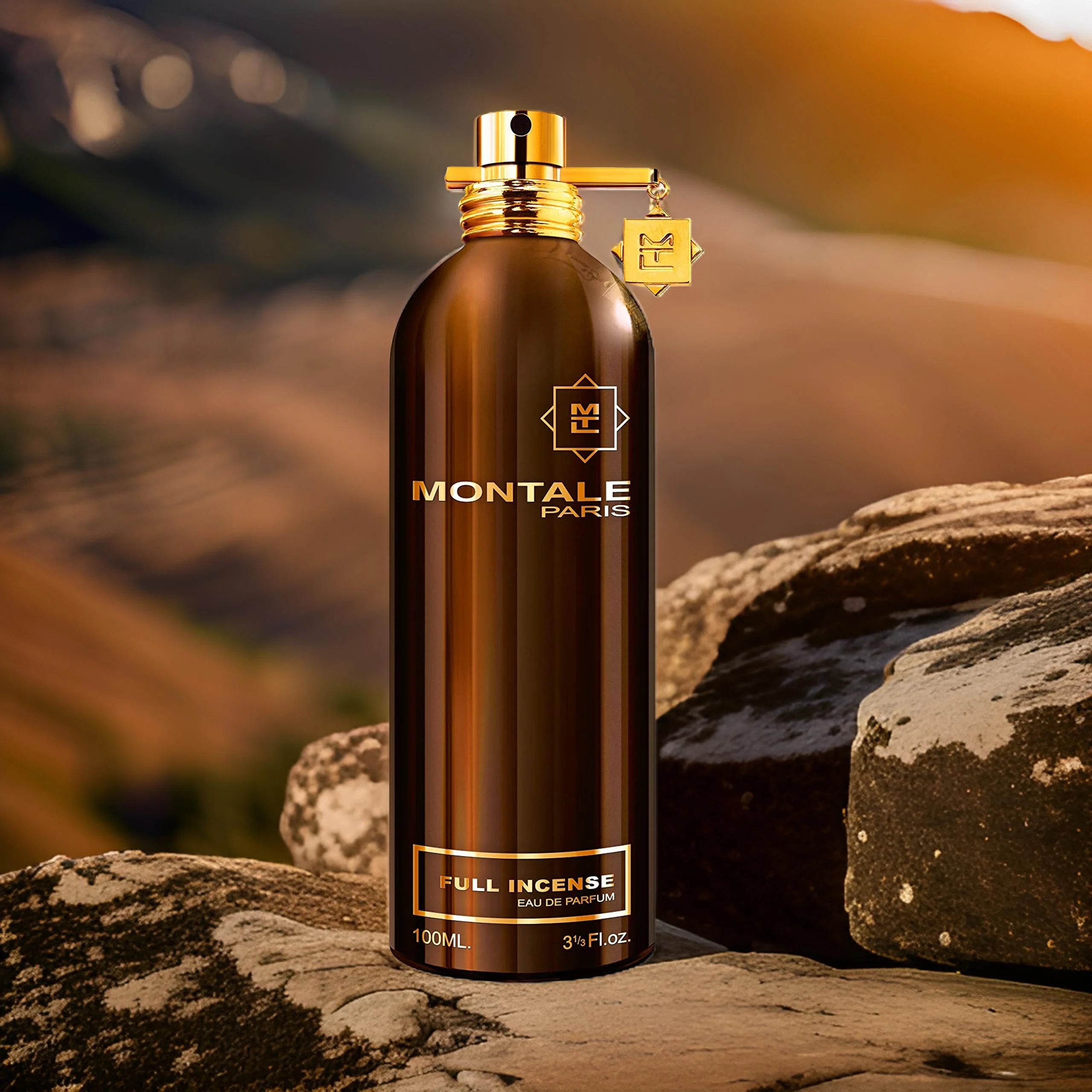 Montale Full Incense Eau De Parfum 100ml showcased outdoors on rocks, highlighting its earthy, woody essence for men and women.
