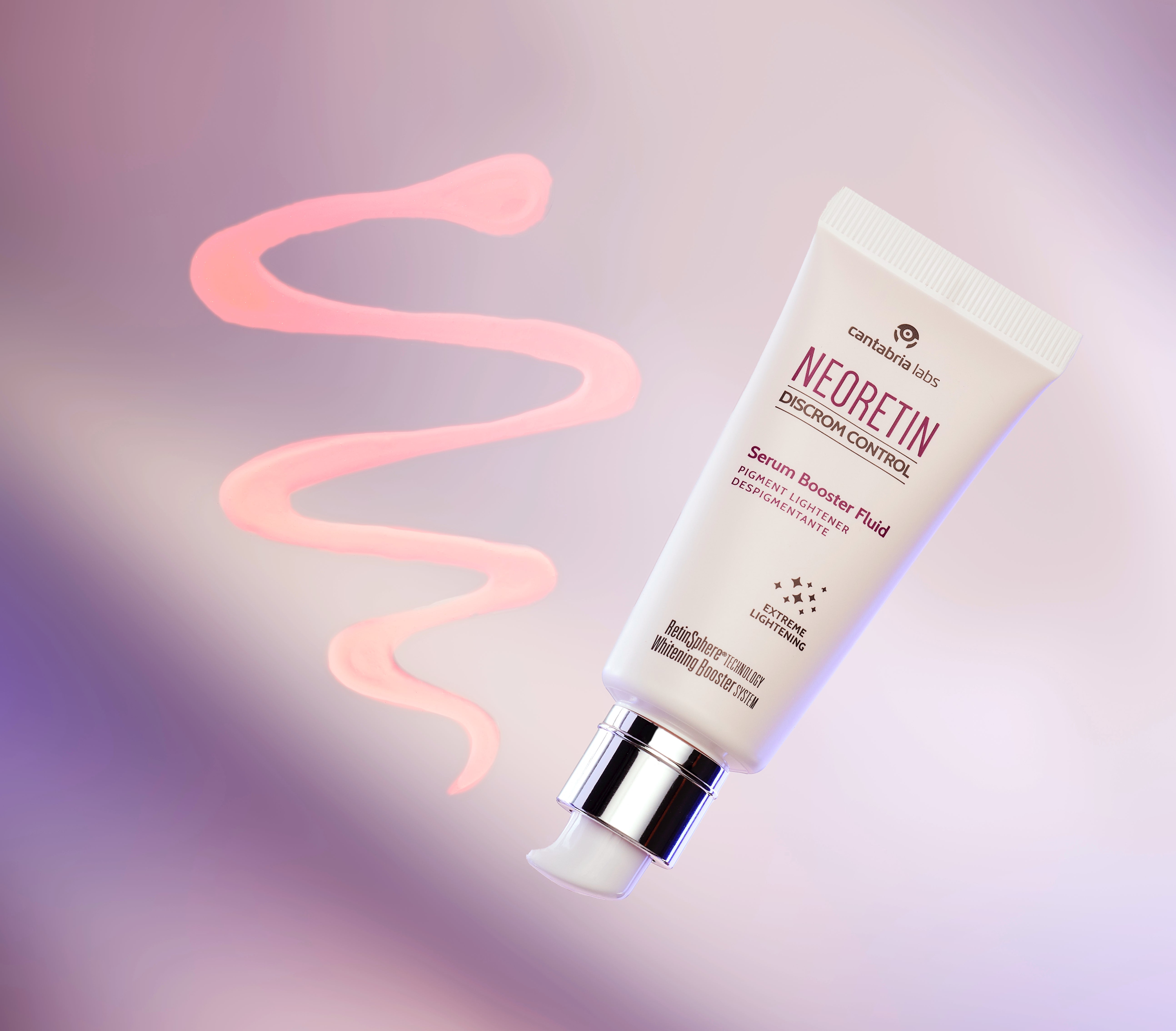 Neoretin Discrom Control Serum Booster Fluid 30ml with pink serum texture swirl, highlighting its lightweight formula for pigmentation control.