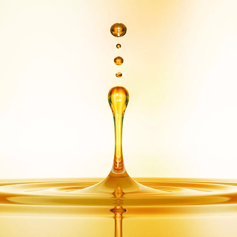 Golden oil drop splash