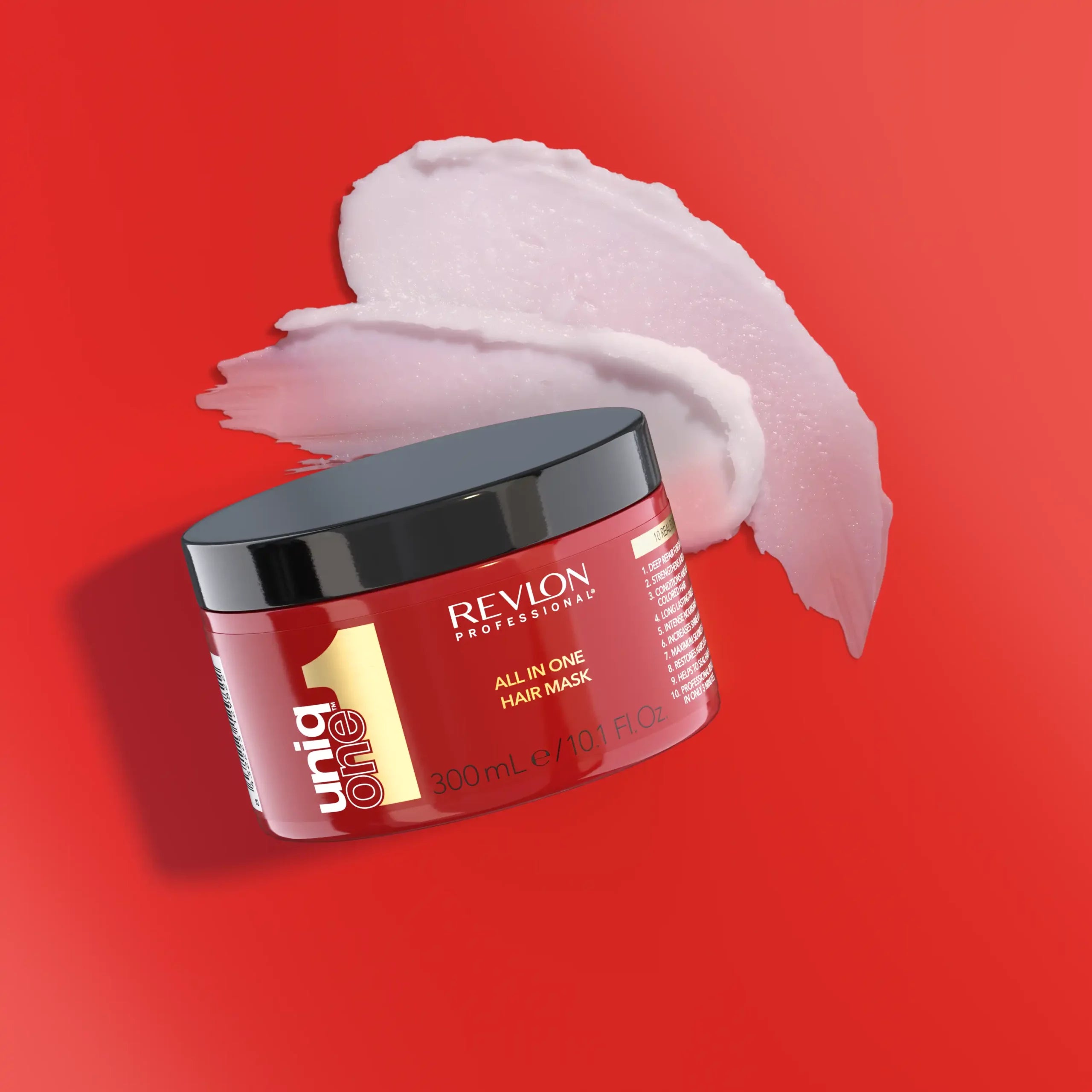 Revlon Uniq One Hair Mask with cream on red background