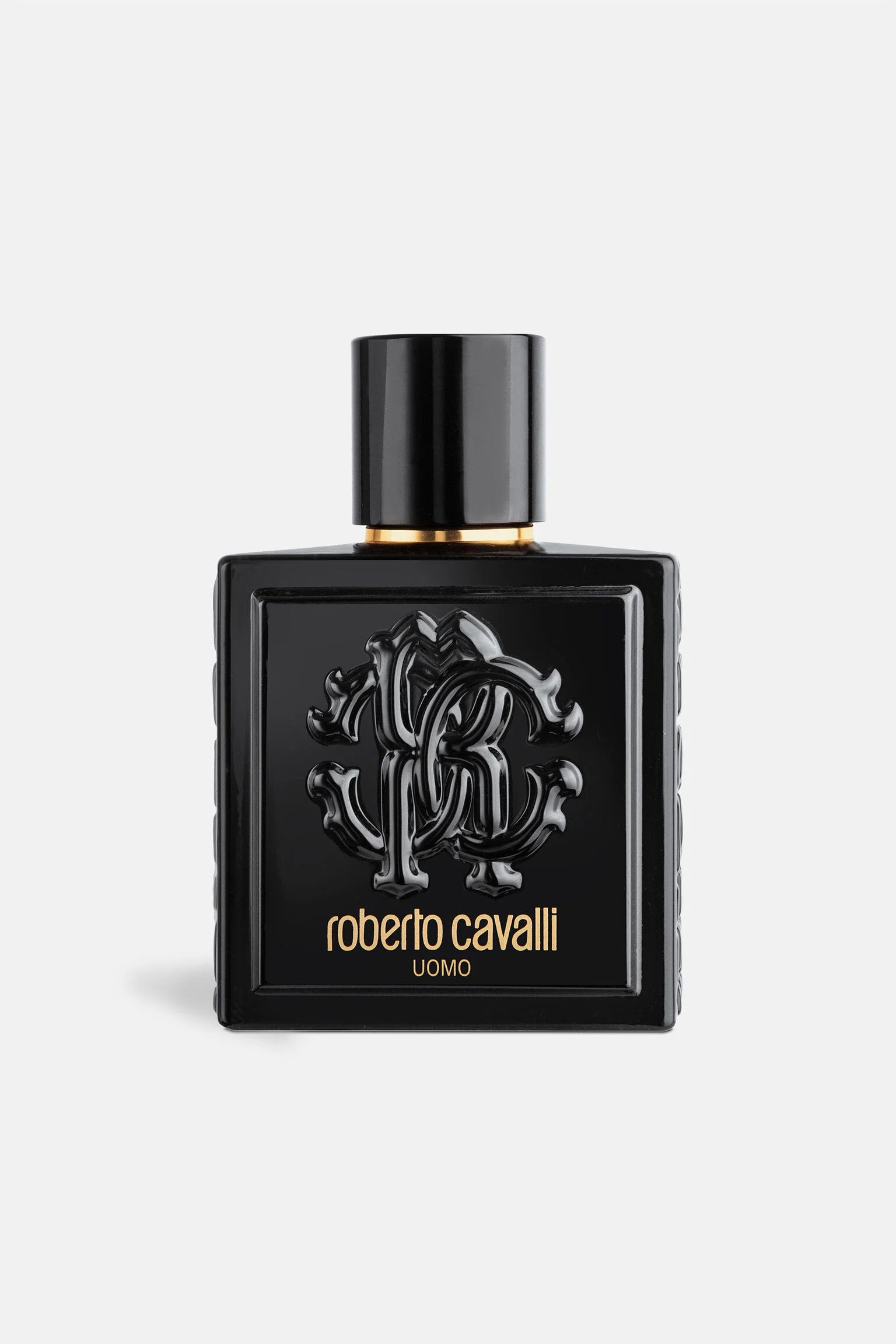 Roberto Cavalli UOMO EDT 100ml bottle in glossy black with embossed logo, a bold oriental fragrance for men.