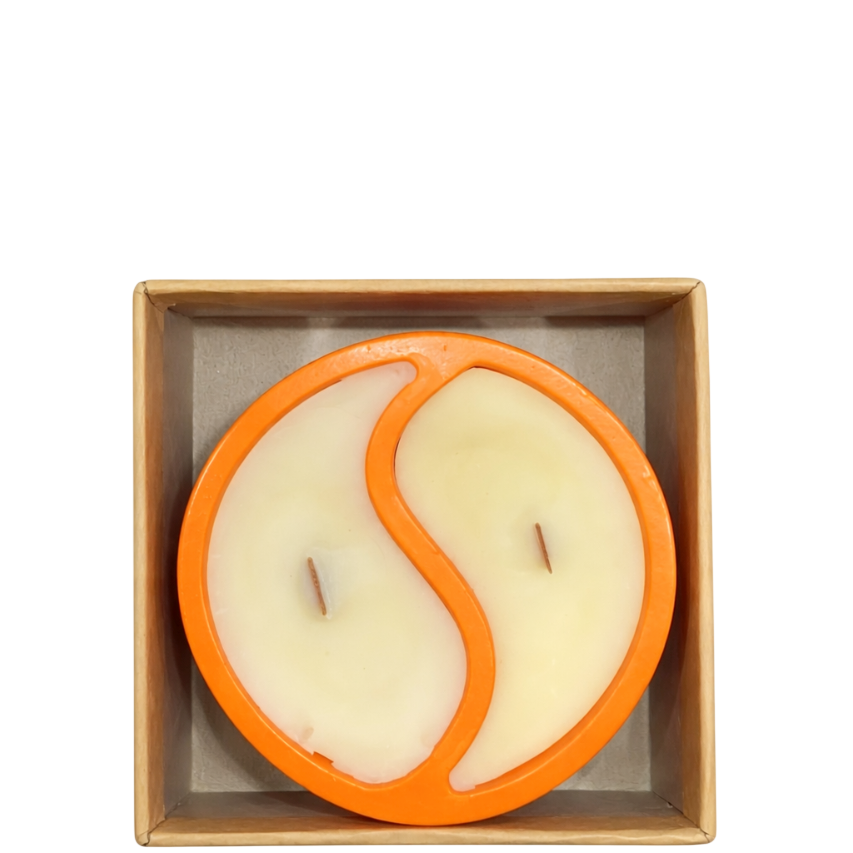 Top view of SerrBeauty Autumn Ember Candle showing yin-yang wax pattern and dual wooden wicks in vibrant orange container, perfect for autumn ambiance.