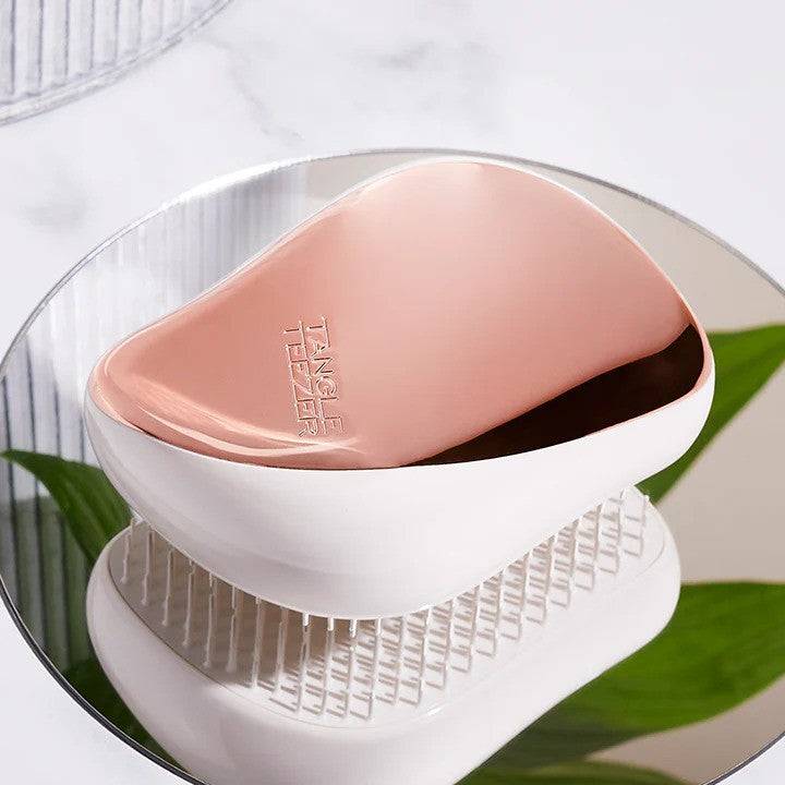 Tangle Teezer Compact Styler Rose Gold-Ivory hairbrush with a sleek rose gold top and ivory base, designed for detangling and smoothing hair effortlessly.