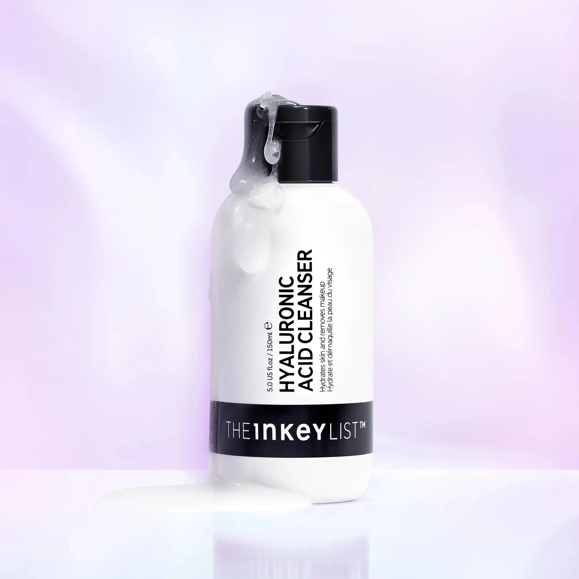 The Inkey List Hyaluronic Acid Cleanser 150 ml bottle with foaming cleanser dripping, highlighting its hydrating and nourishing formula for skincare.