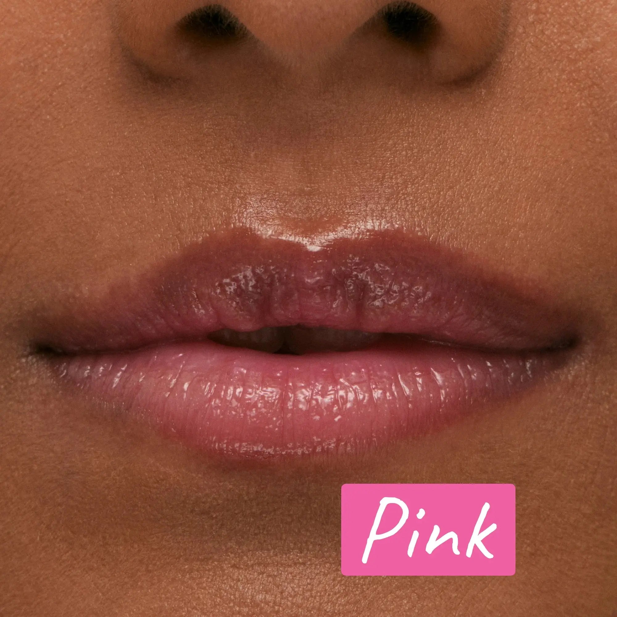 Close-up of lips wearing The Inkey List Tripeptide Plumping Lip Balm in Pink Tint. Provides a natural, glossy finish while hydrating and plumping.