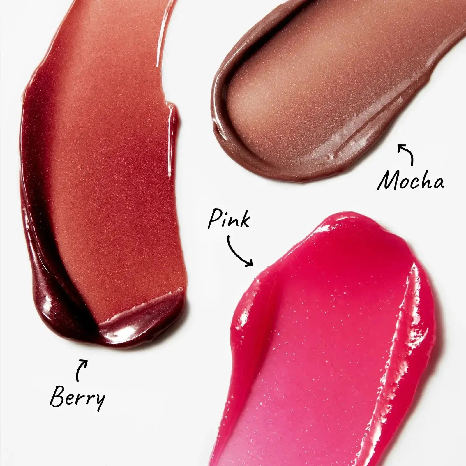 Swatches of The Inkey List Tripeptide Plumping Lip Balm in Berry, Pink, and Mocha shades. Hydrating formula enhances lip volume and smoothness.