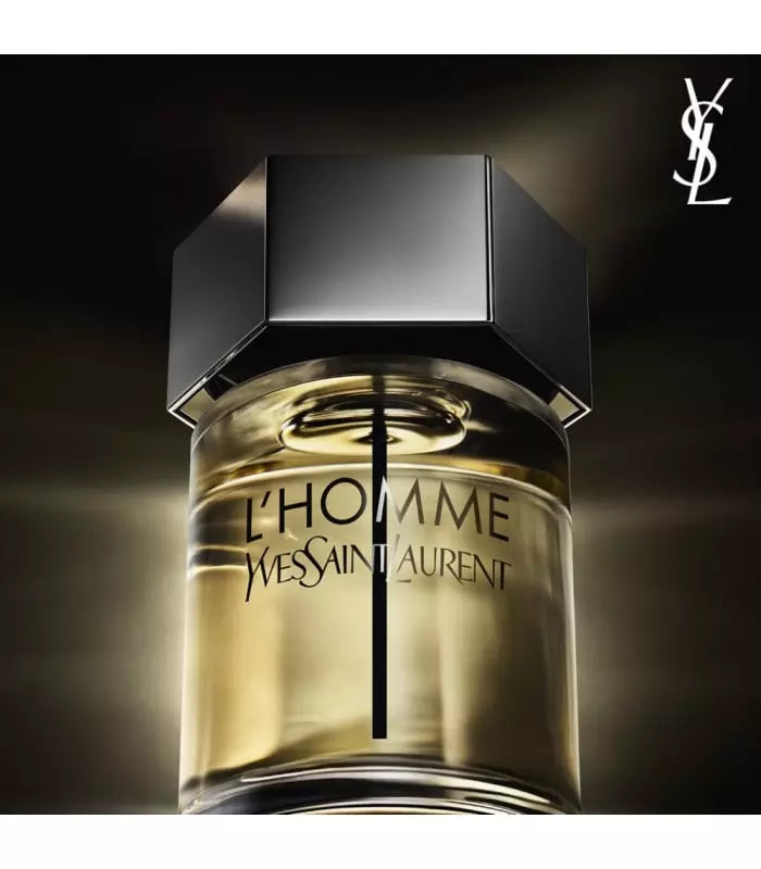 Close-up of YSL L'Homme Eau De Toilette bottle highlighting the elegant glass design and bold cap. Men's fragrance with ginger, musk, and cedar notes.