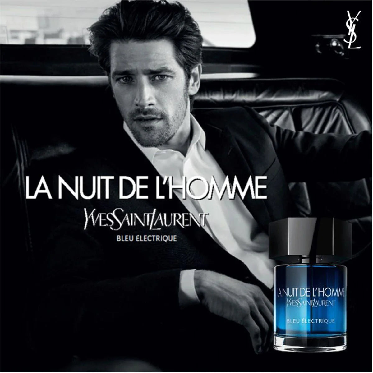 YSL La Nuit De L'Homme Eau Electrique perfume ad featuring a man in a car, showcasing the bold and seductive scent for men.