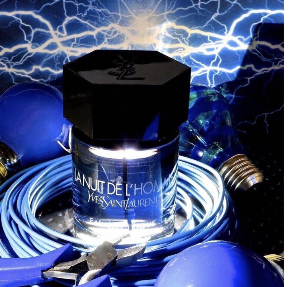 YSL La Nuit De L'Homme Eau Electrique 60ml surrounded by electric blue wires and bulbs, emphasizing its vibrant masculine fragrance.